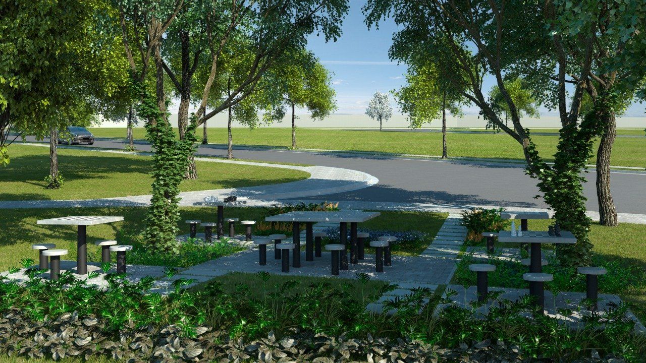 area-verde Um grupo de mesas de piquenique em um parque com árvores ao fundo