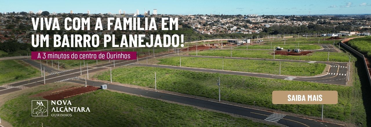 bairro-planejado Uma vista aérea de uma área residencial com uma cidade ao fundo.