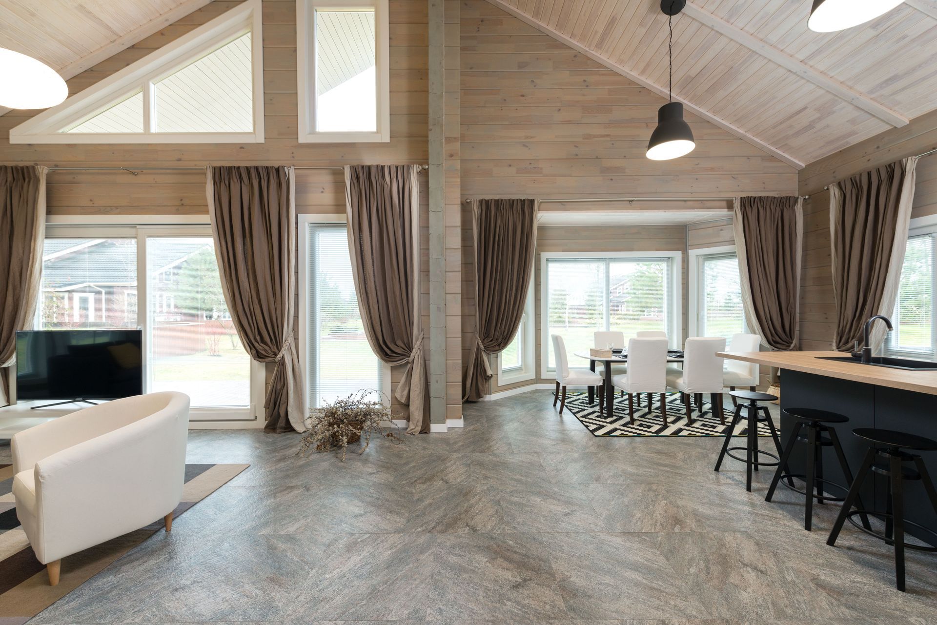Polished beige tiled floor with small brown diamond accents and a doormat near the top edge