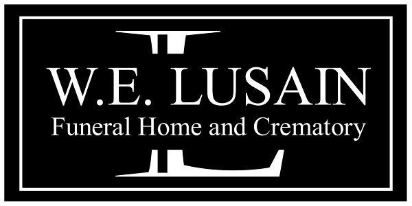 W.E. Lusain Funeral Home and Crematory logo in white text on a black background framed by a rectangular border.
