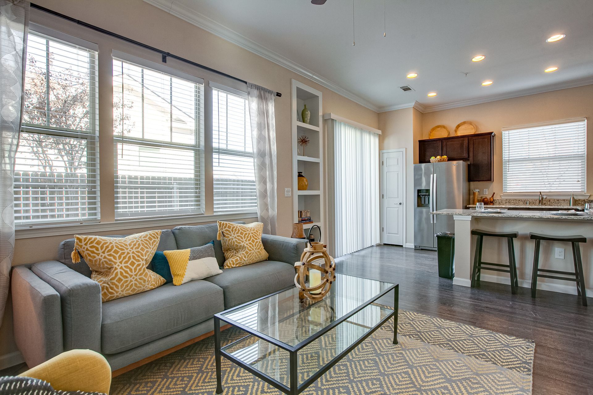 A living room with two couches and a glass coffee table.