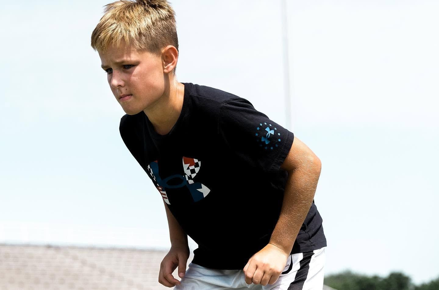 Athlete preparing to accelerate during an outdoor training drill