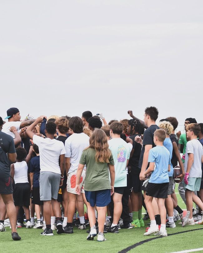 Youth athletes gathered with a coach at The Circle Performance