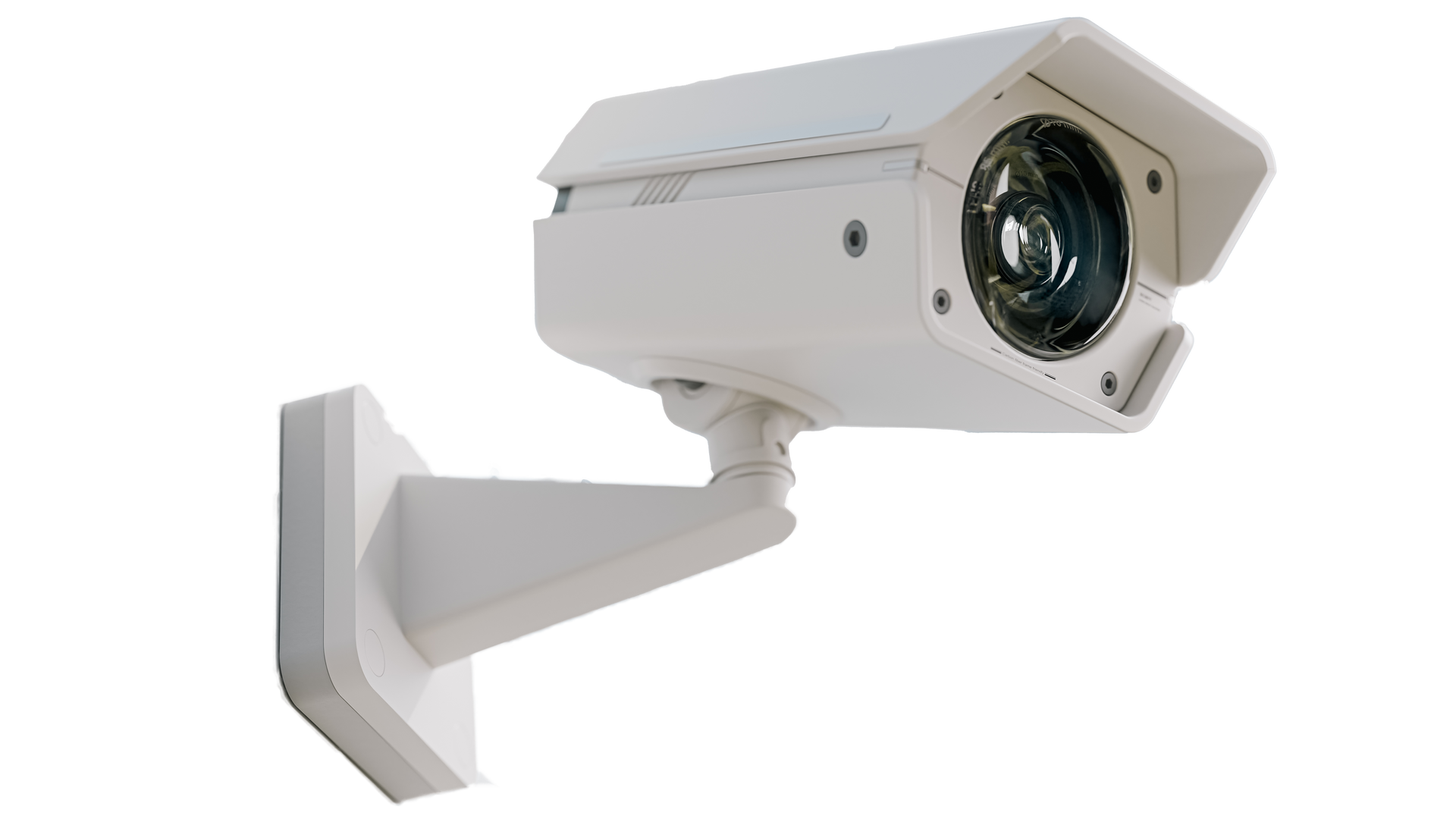 A white security camera is mounted to a wall.