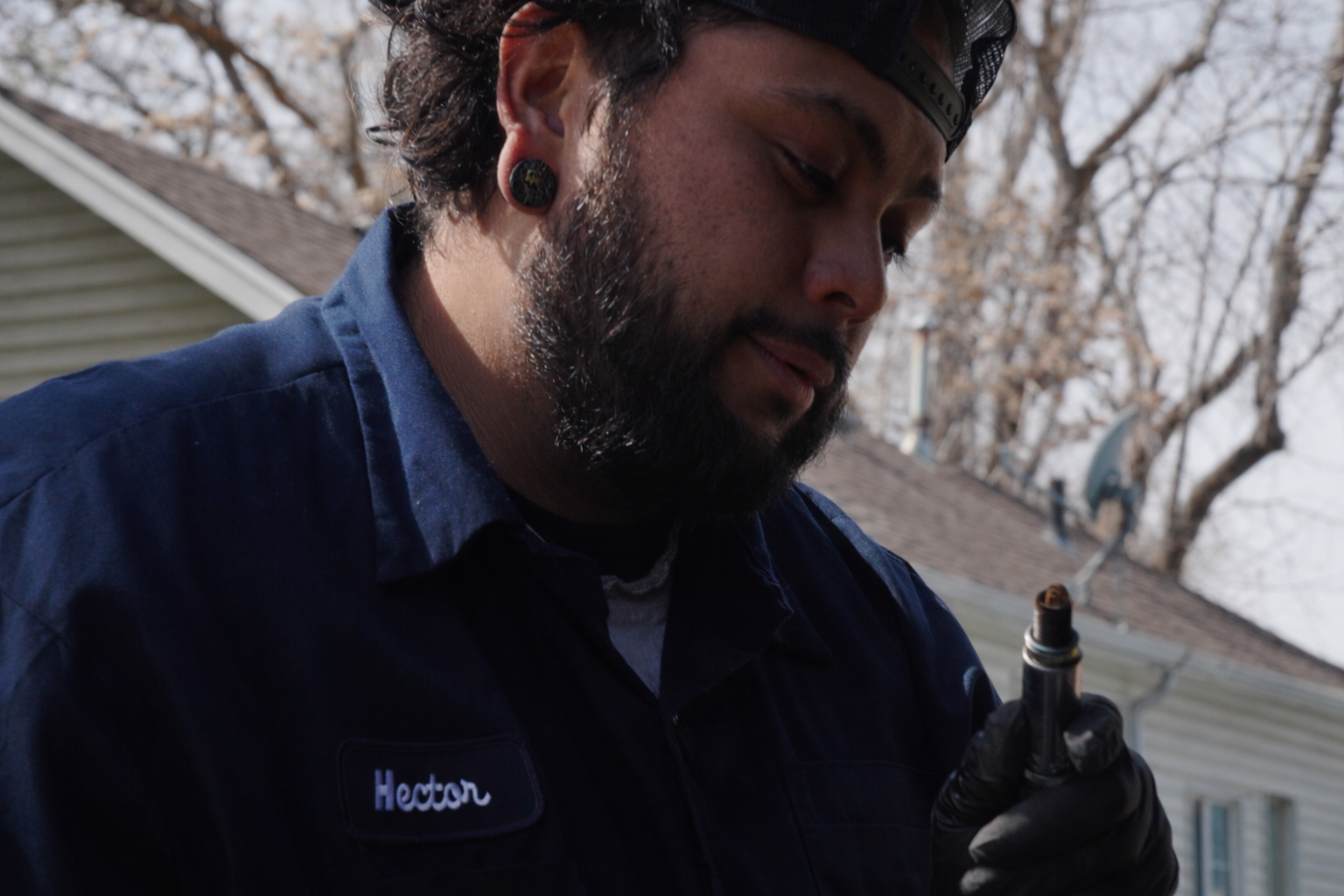 Mobile mechanic diagnosing worn engine component in Salt Lake City