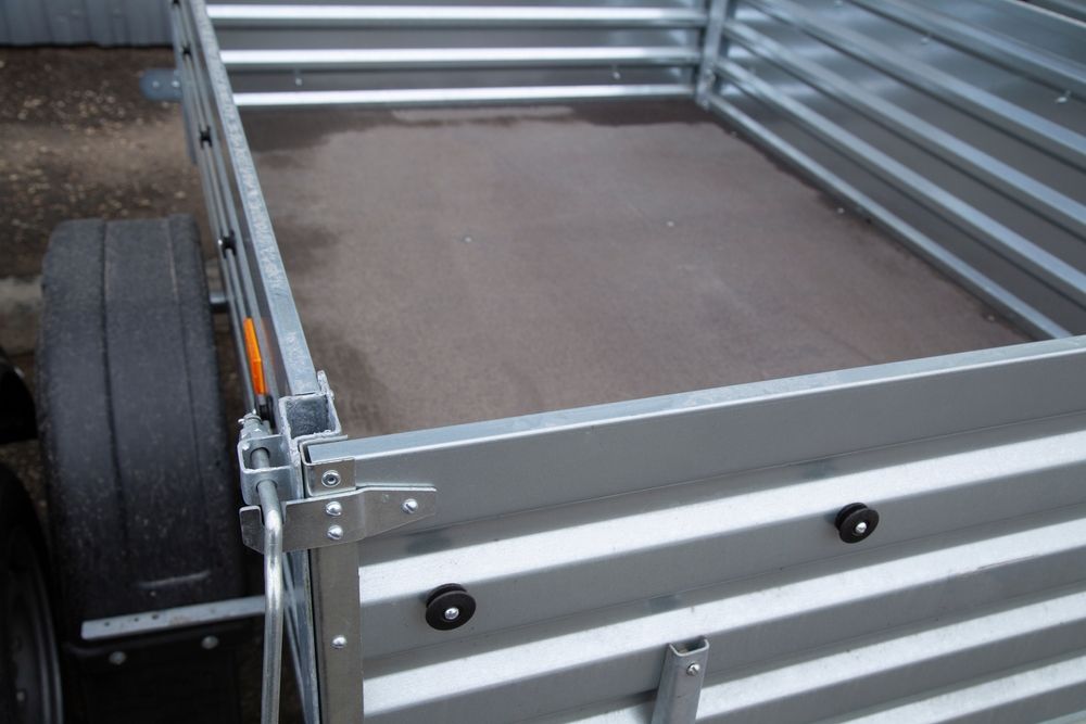 Metal Trailer Bed with Dark Flooring and Side Rails — Centre Trailer Sales In Alice Springs, NT
