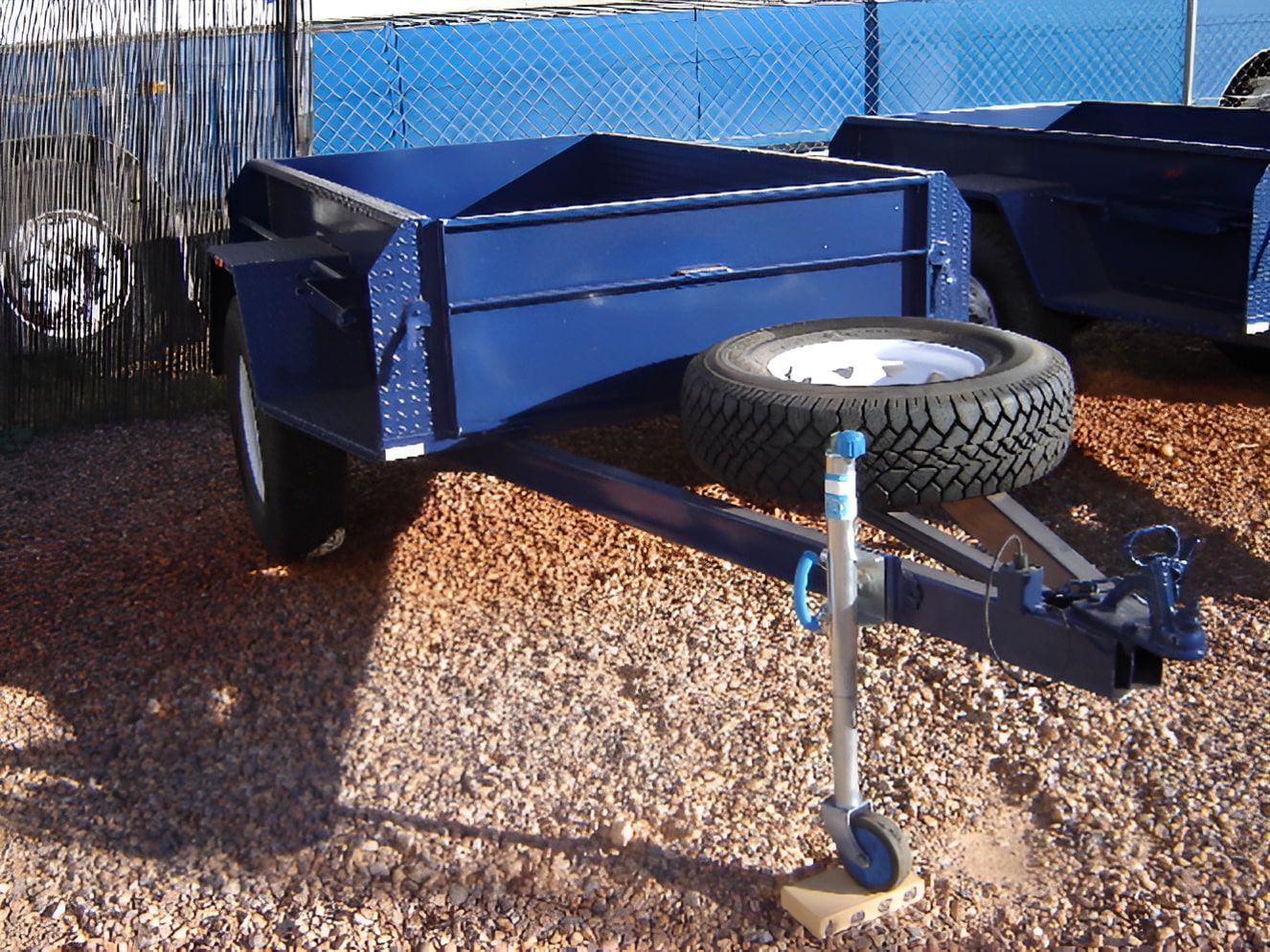 A Blue Trailer with A Tire Attached to It — Centre Trailer Sales In Alice Springs, NT
