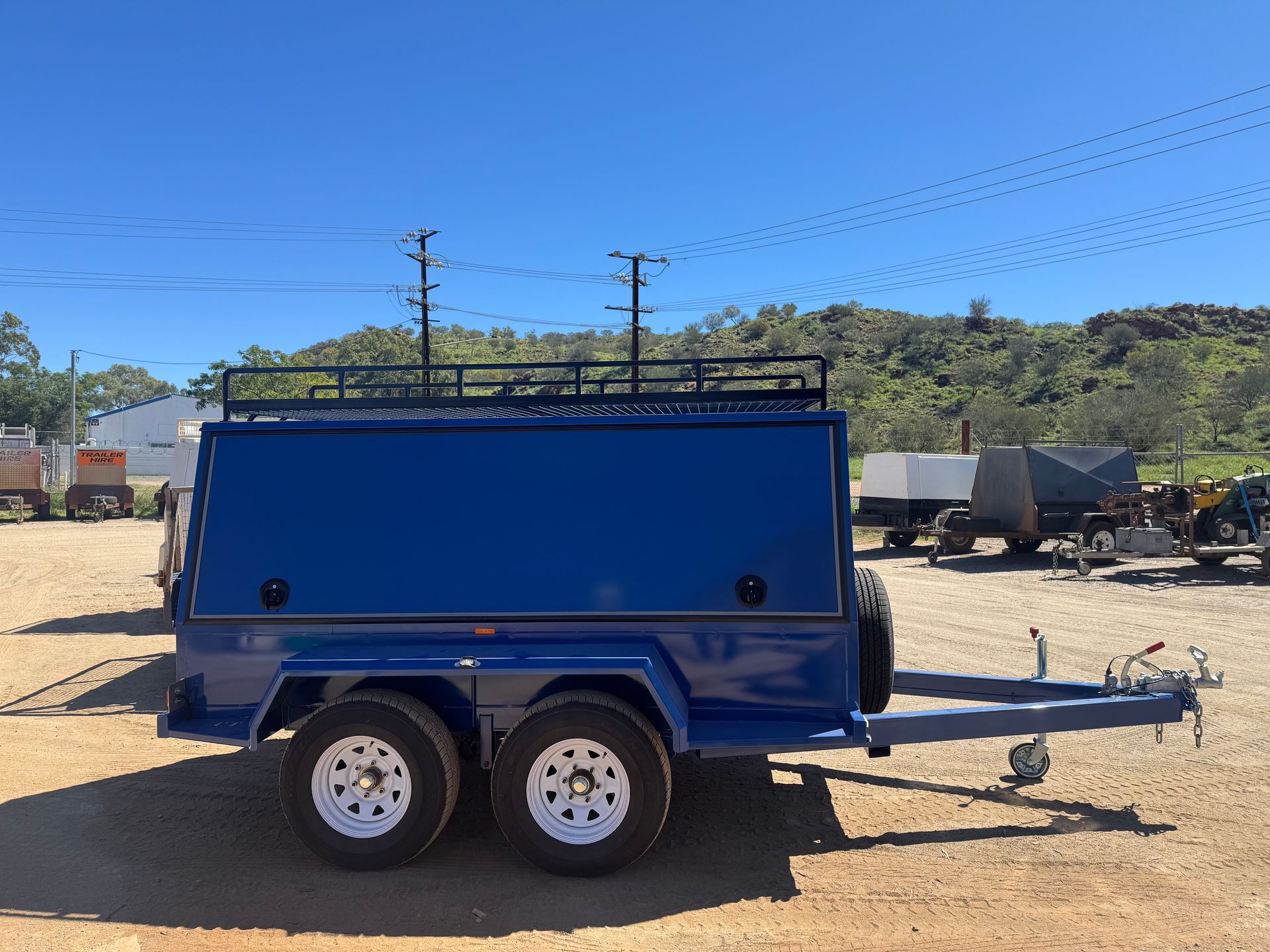 Blue Utility Trailer with Enclosed Storage Spare Tire — Centre Trailer Sales In Alice Springs, NT