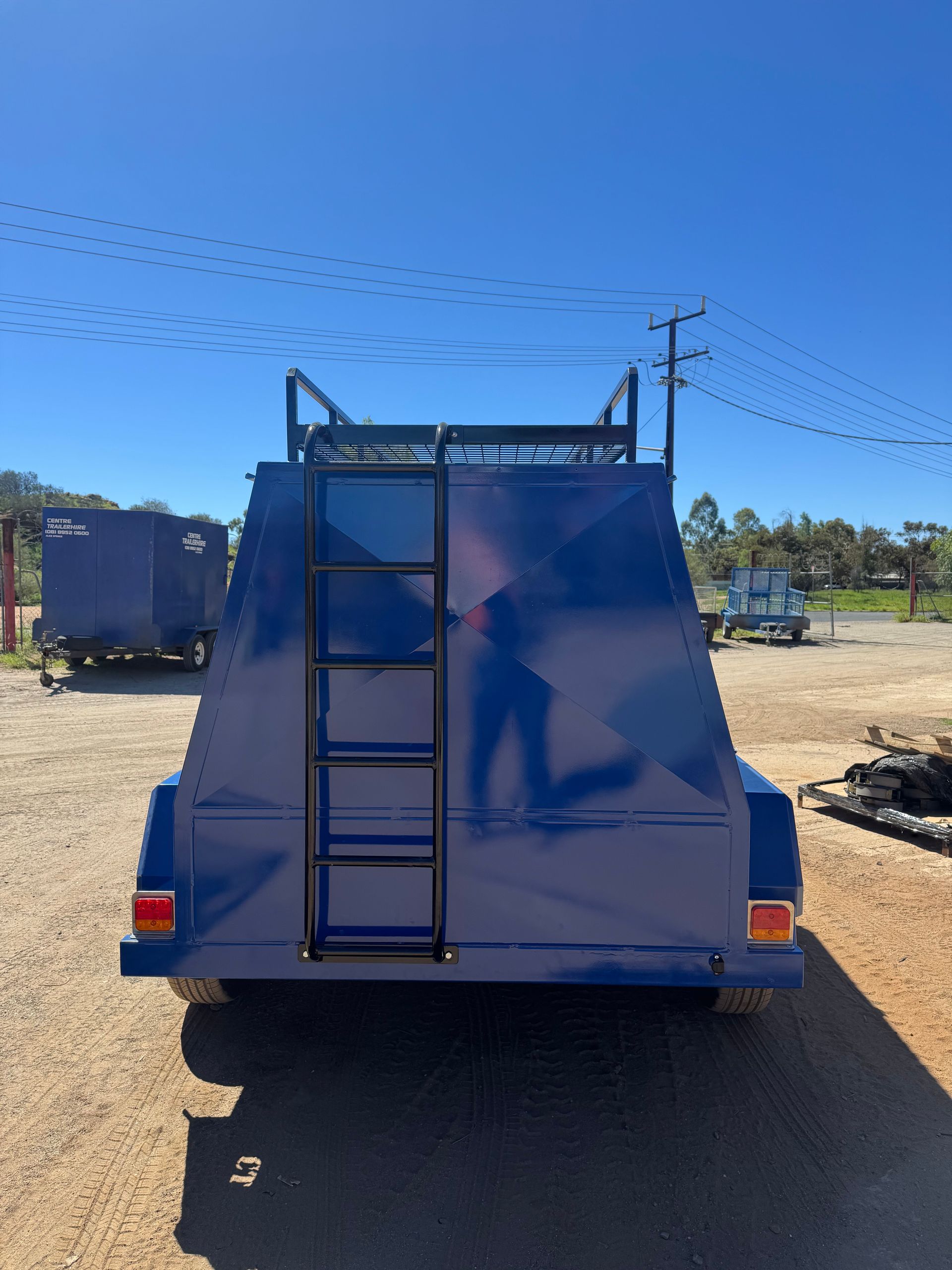 Blue Utility Trailer with Ladder and Overhead Rack — Centre Trailer Sales In Alice Springs, NT