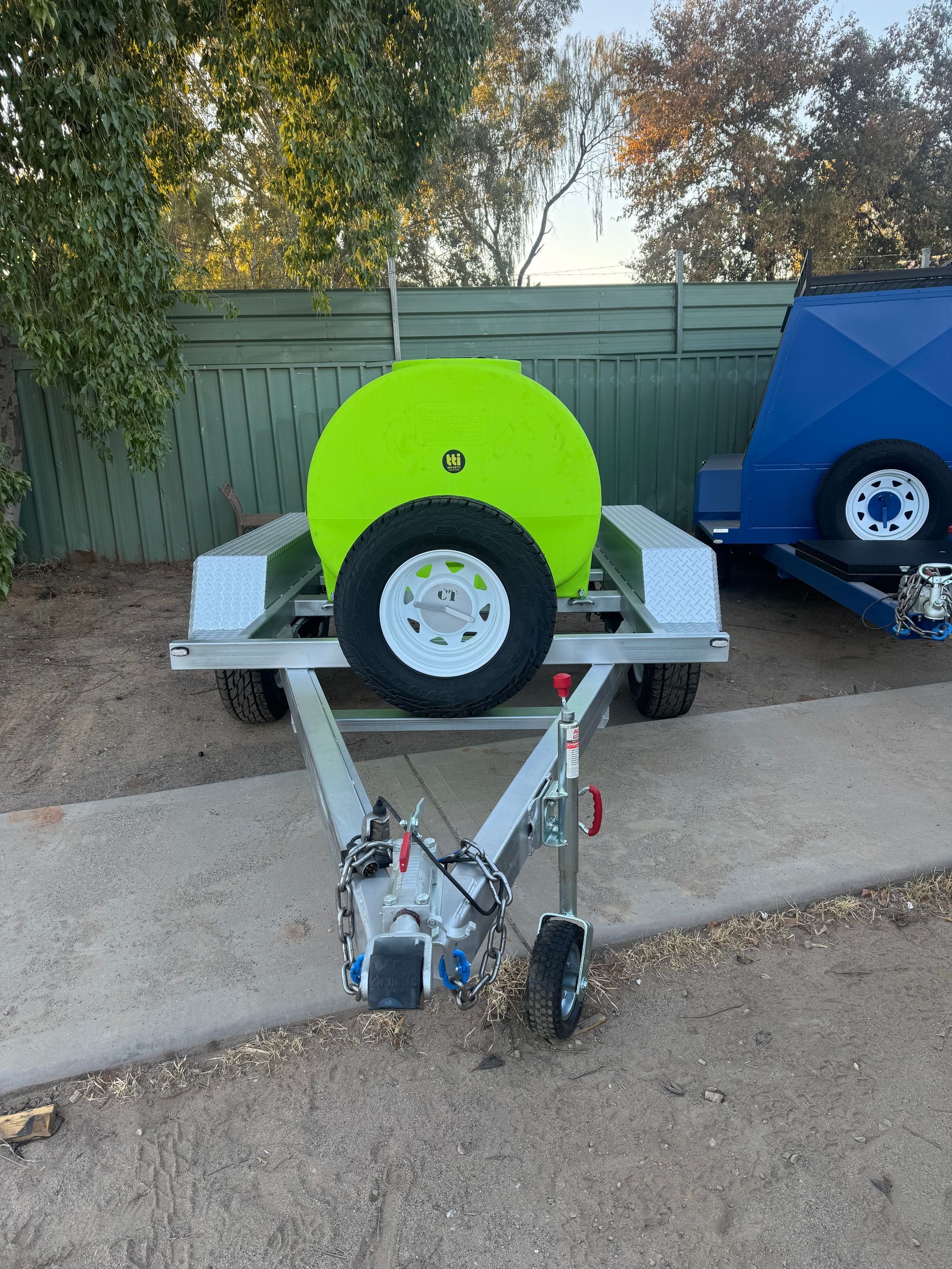 Silver Trailer with A Lime-Green Hose Reel, Spare Tire — Centre Trailer Sales In Alice Springs, NT