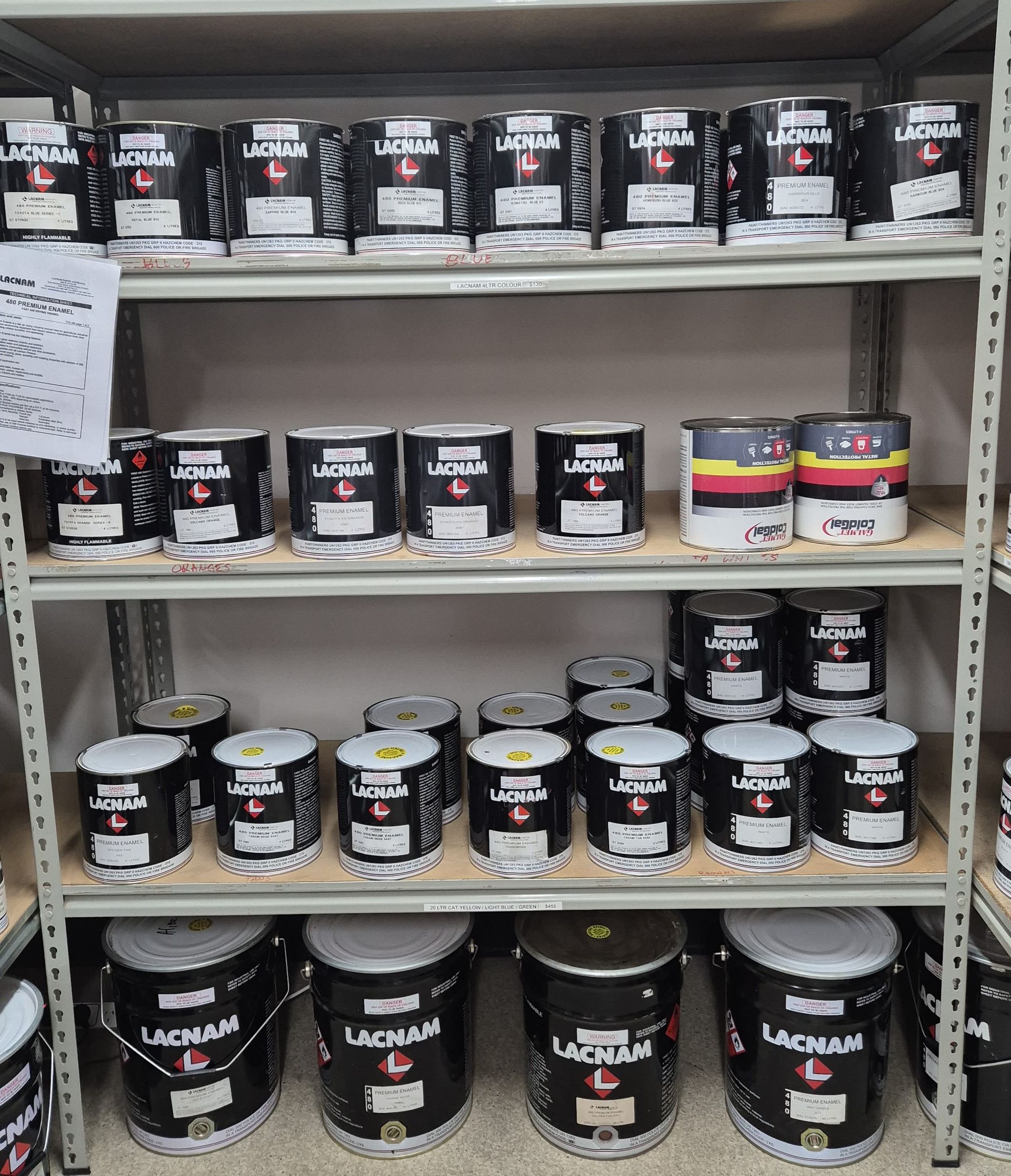 A Shelf Filled With Lots Of Cans Of Paint — Centre Trailer Sales In Alice Springs, NT