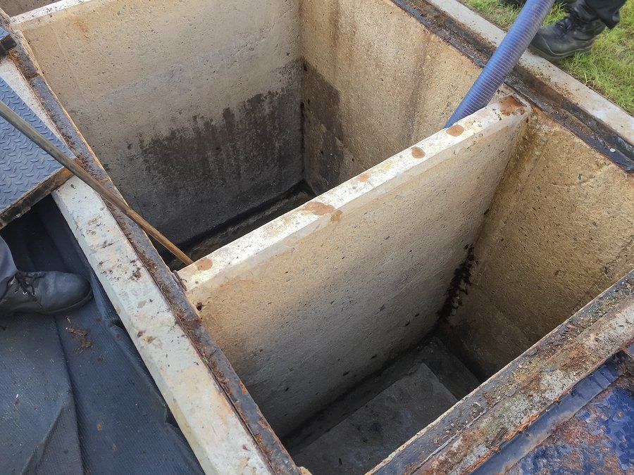 workers cleaning the septic tank