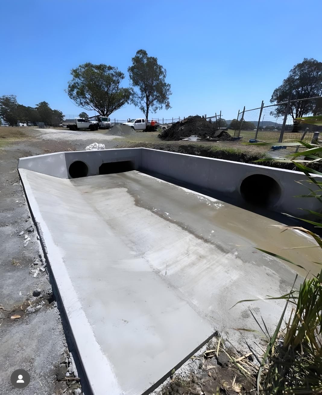 A Large Concrete Structure is Being Built Next to a Road — Coastal Kerb and Concrete In Newcastle, NSW