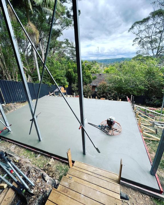 A Concrete Floor is Being Built on Top of a Wooden Deck — Coastal Kerb and Concrete In Buff Point, NSW