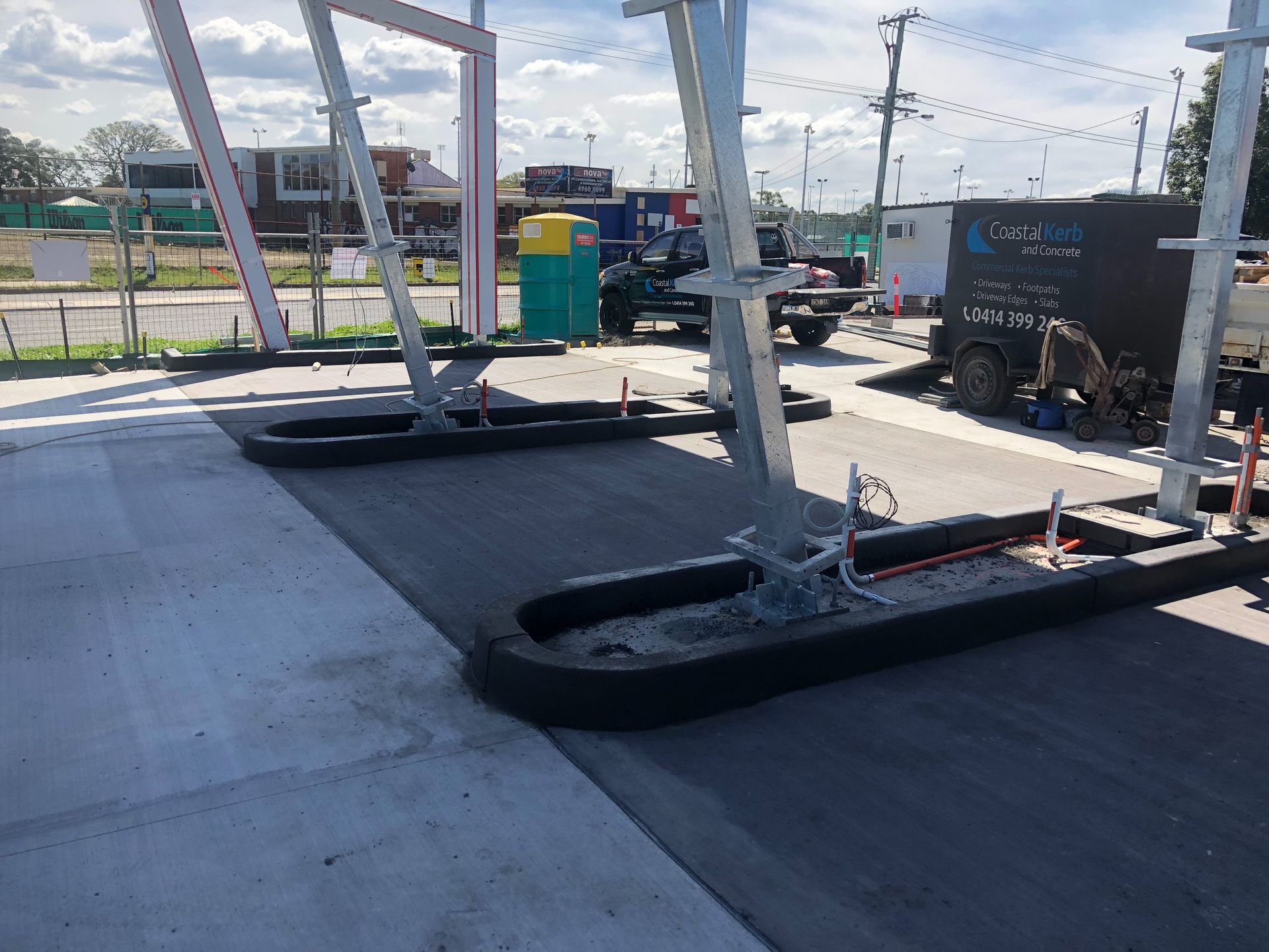 A Gas Station Under Construction With a Truck Parked in the Background — Coastal Kerb and Concrete In Buff Point, NSW