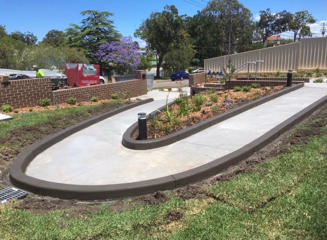 A Concrete Walkway is Being Built in a Park — Coastal Kerb and Concrete In Buff Point, NSW