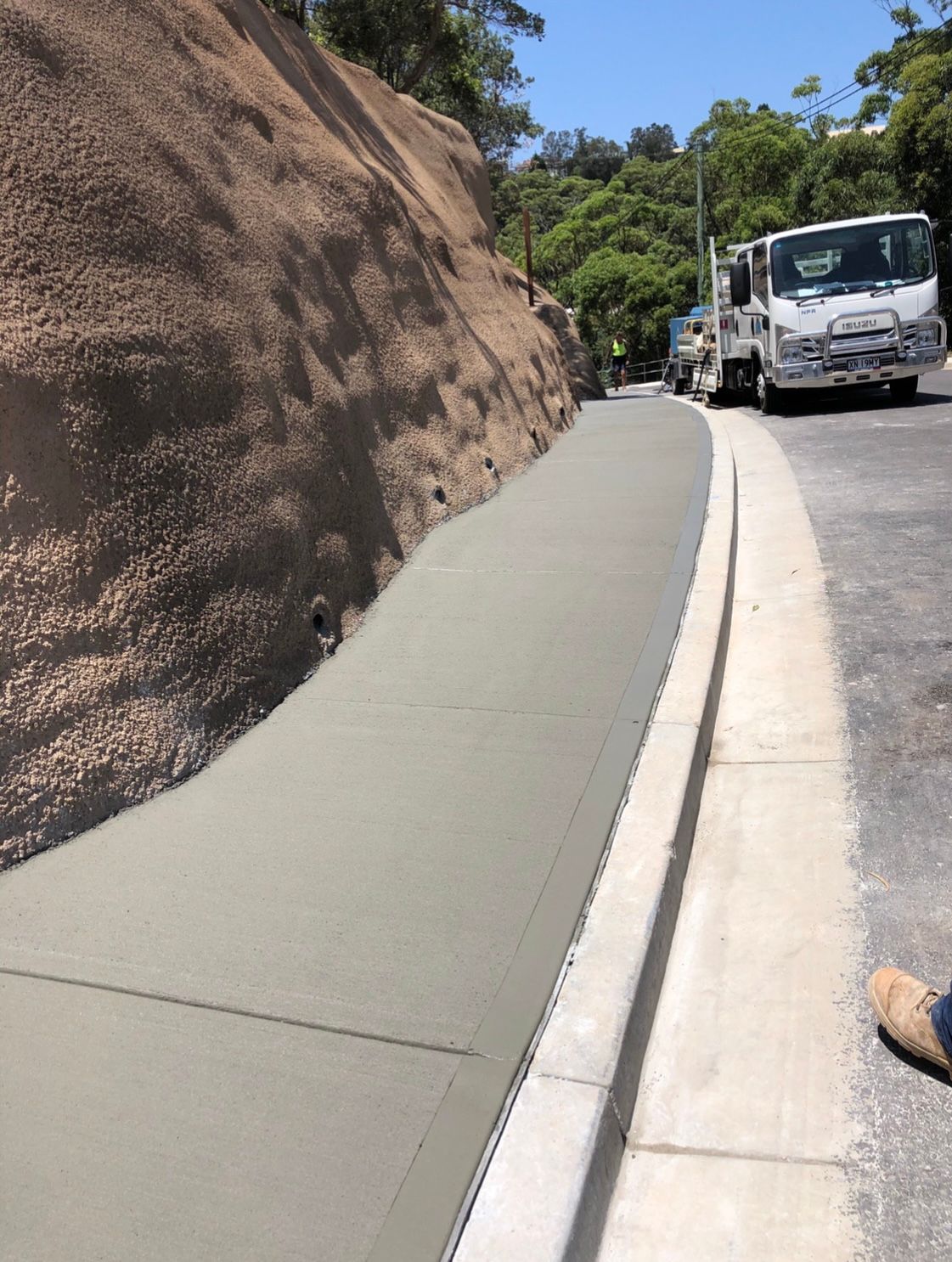 A Truck is Parked on the Side of a Road Next to a Sidewalk — Coastal Kerb and Concrete In Buff Point, NSW