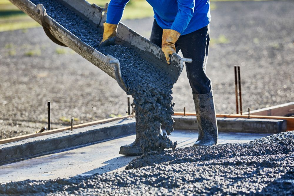Worker Pouring Concrete 