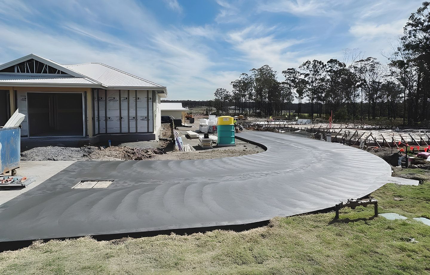 New Concrete Driveway Installation At Residential Construction Site