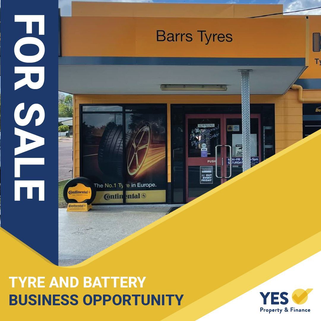 Building for sale: Barrs Tyres shop front, yellow and blue sign,