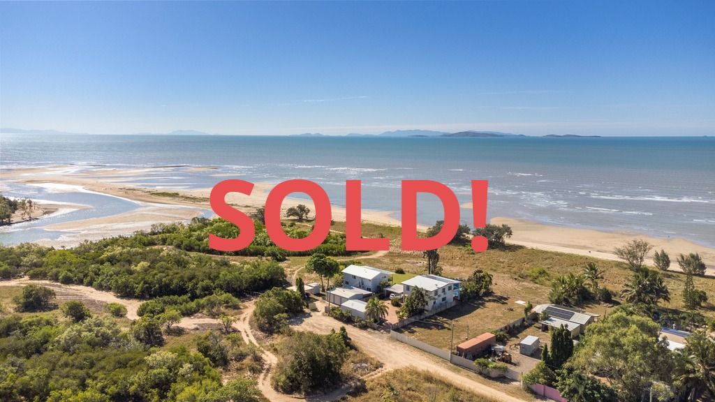 Aerial view of beachfront property with