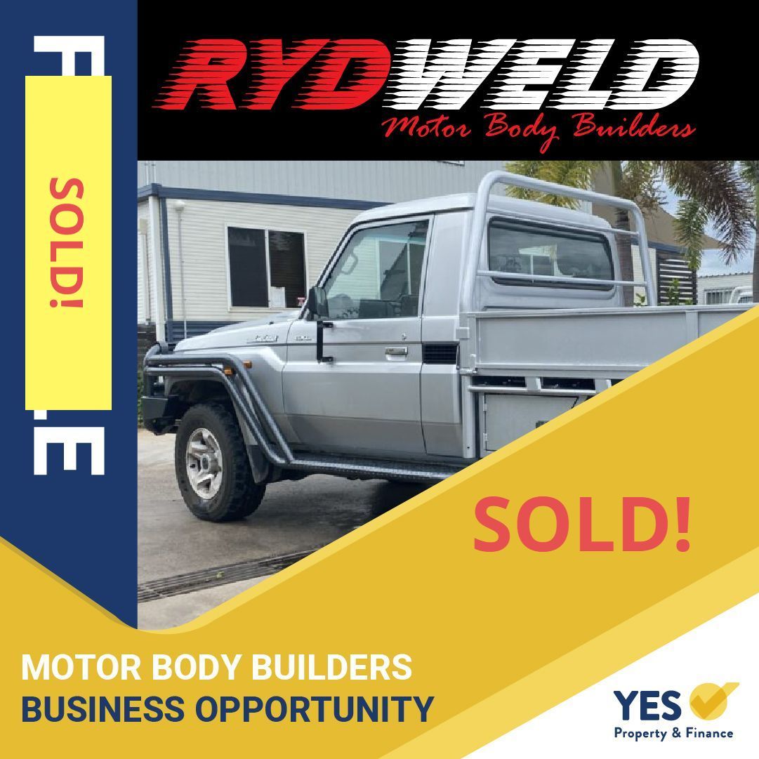 Silver pickup truck with a flatbed,