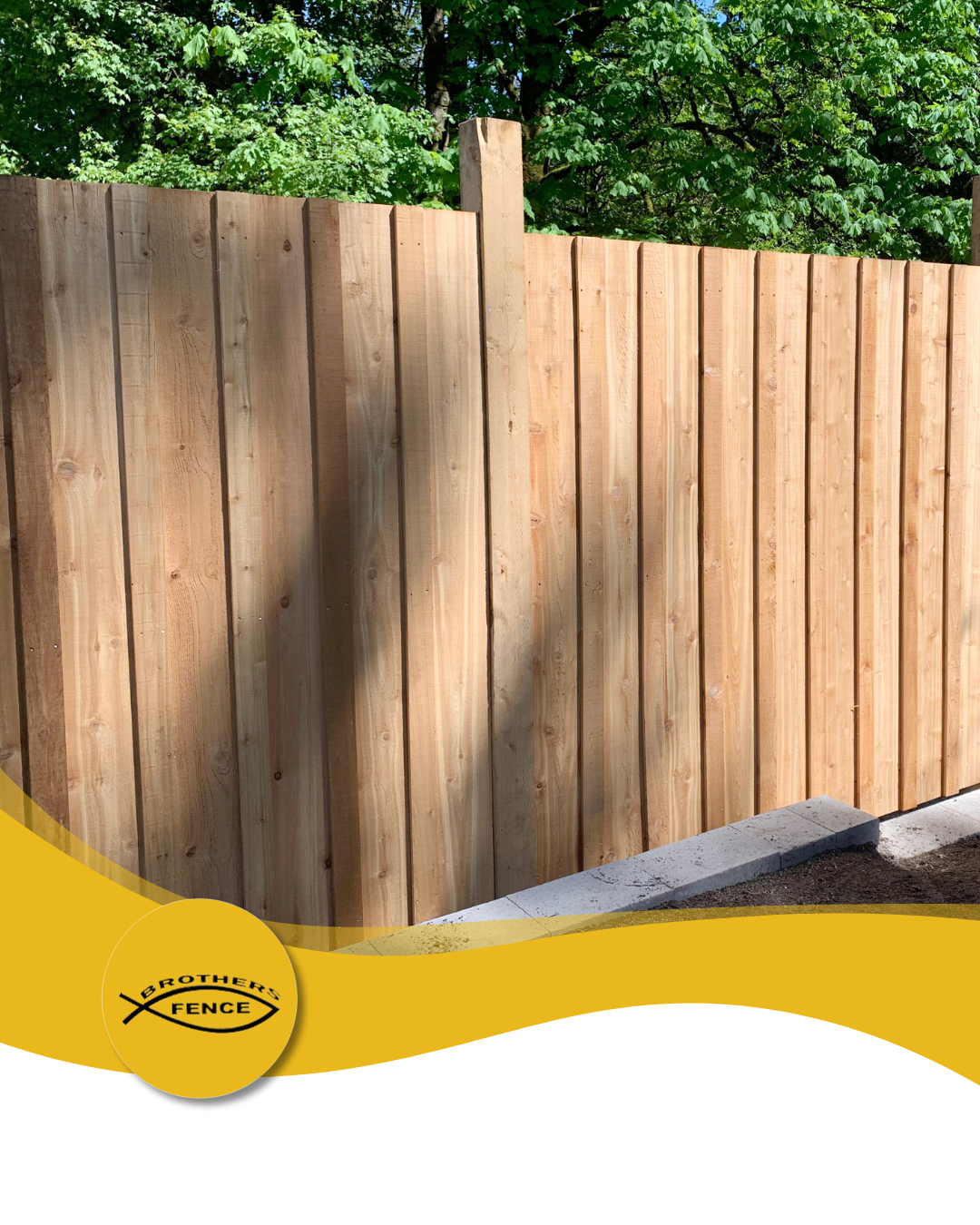 Wooden fence with a logo in the bottom left corner; trees in the background, yellow curved design.