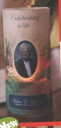 An urn featuring a portrait of Helen C. Bond and the text 