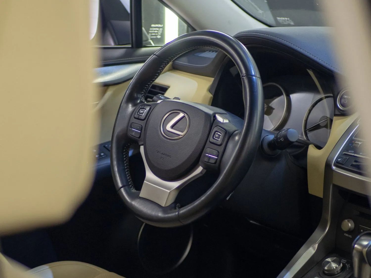 Lexus steering wheel and dashboard interior with black leather and silver accents