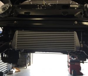 Undercarriage of a vehicle with a silver intercooler and other exposed mechanical parts
