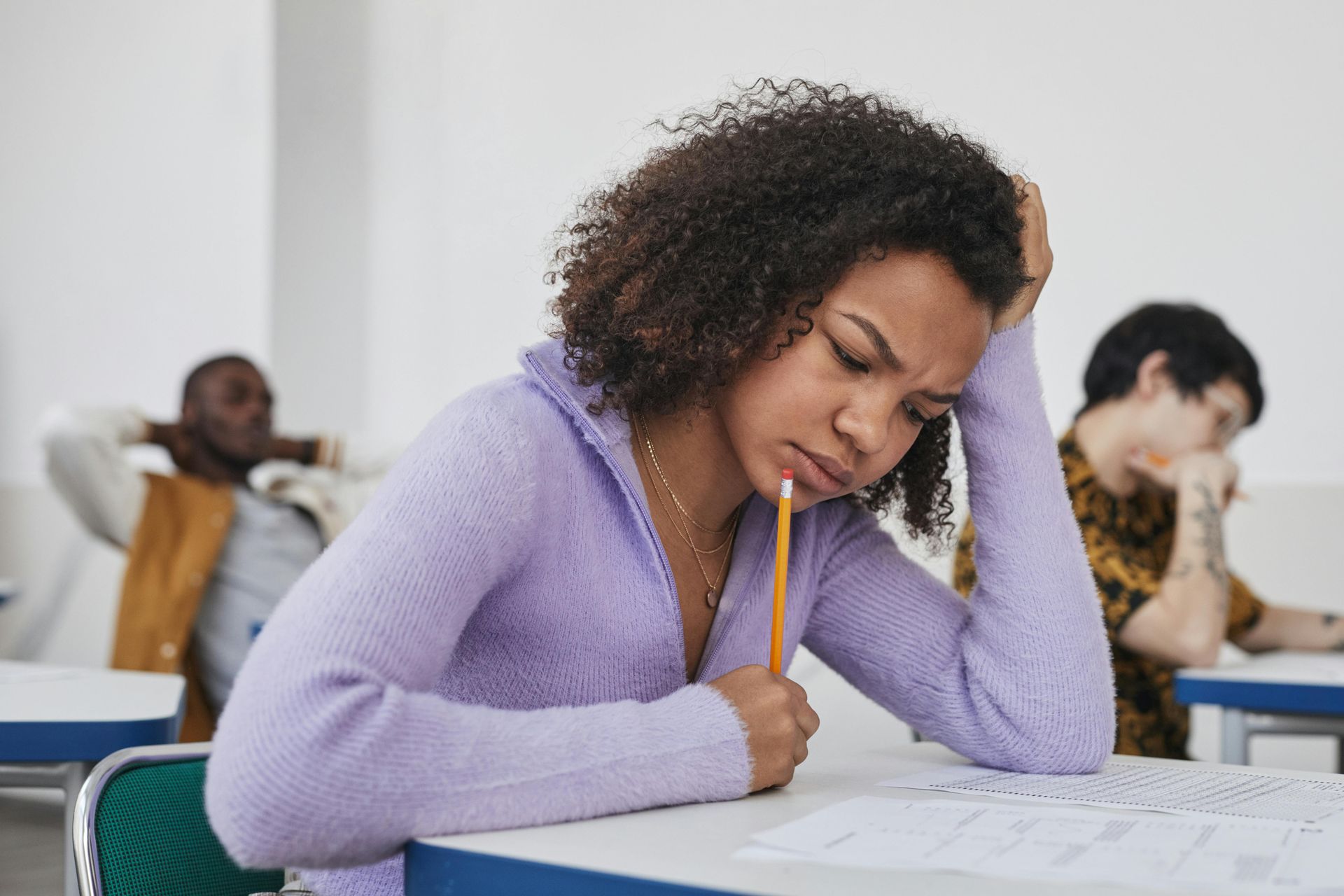 Student studying at home and working through online school assignment.