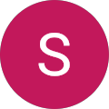 White “S” on a pink circular background