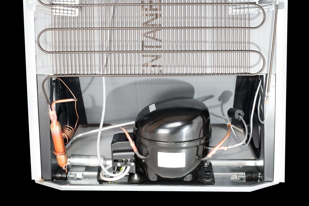 Domestic Refrigerator Compressor Mounted On The Rear Side — North West Heating, Cooling and Refrigeration in Taminda, NSW