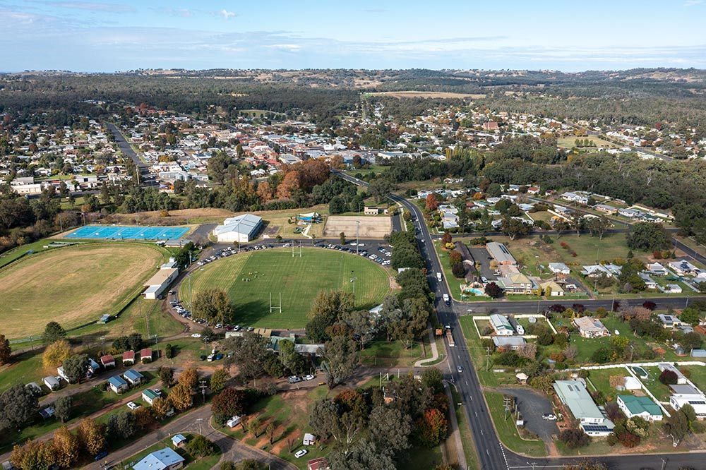 An Aerial View Of A Small Town With A Soccer Field In The Middle Of It — North West Heating, Cooling and Refrigeration in Coonabarabran, NSW