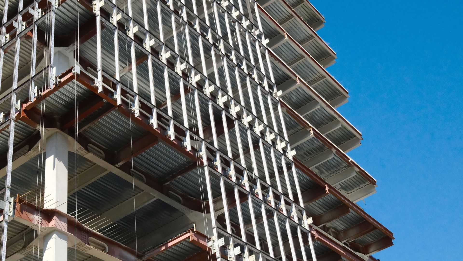 Steel framework of modern high-rise building showing residential structural engineering design. Steel framework of modern high-rise building showing residential structural engineering design.