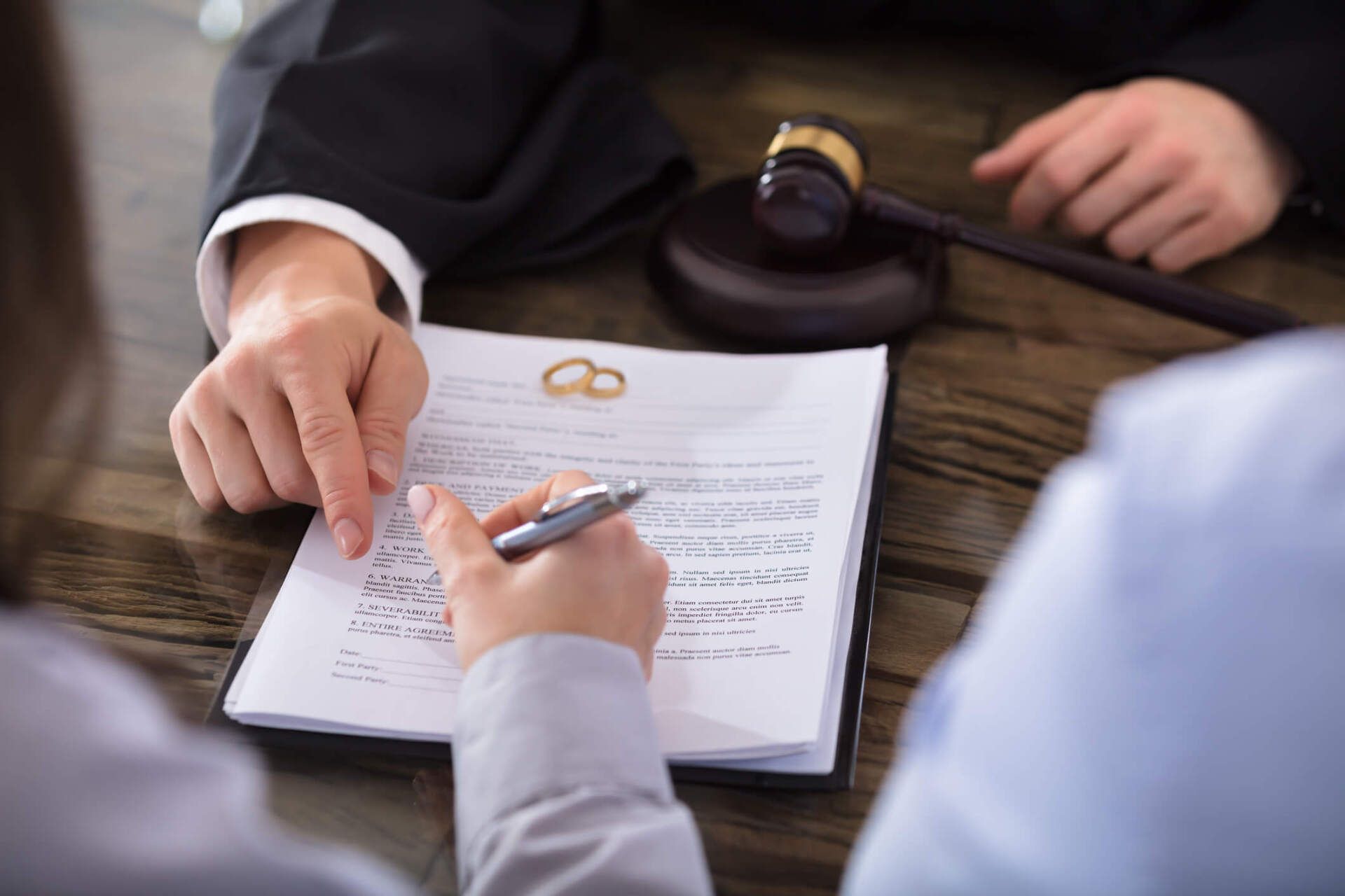 Female Signing Contract — Chesapeake, VA — Peterson Law PLC Female Signing Contract — Chesapeake, VA — Peterson Law PLC
