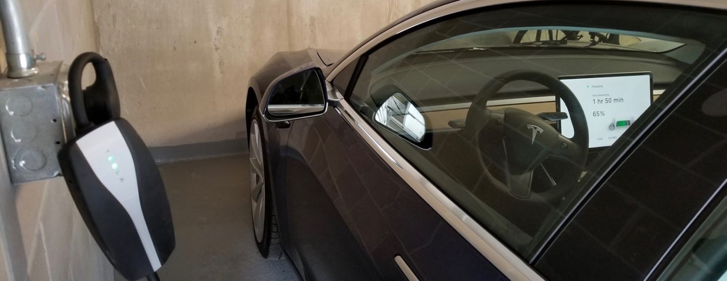 photo showing electric vehicle and bike charging