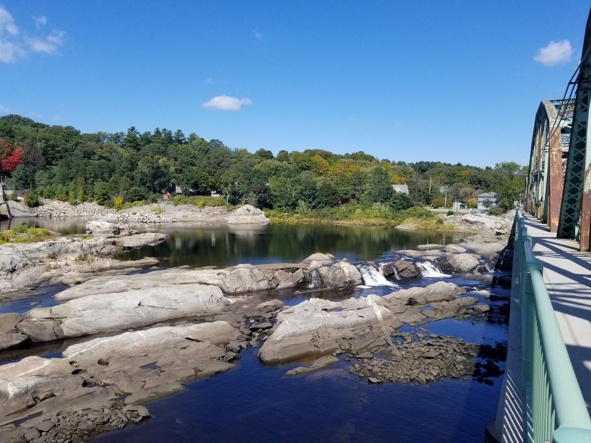 Photo showing a river from a bridge view