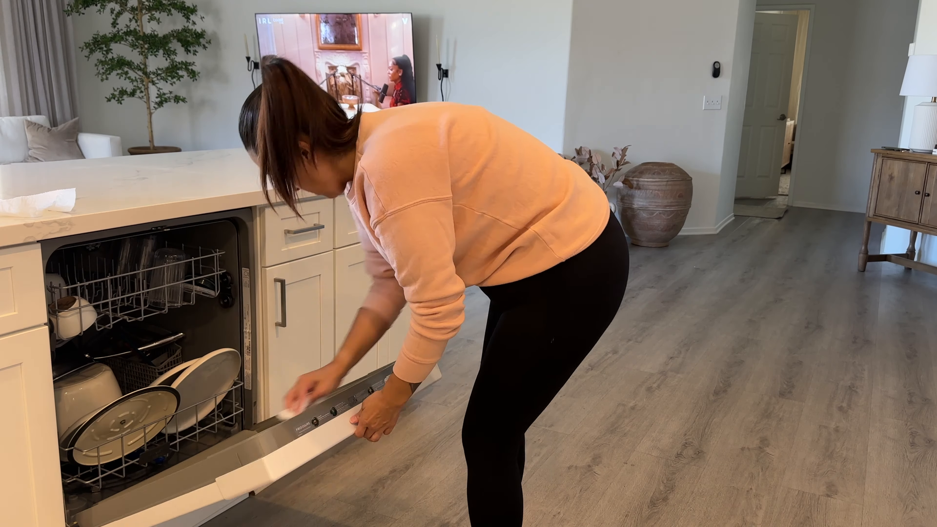 House cleaning service scrubbing a bathroom in Steinway, Queens — apartment cleaning NYC