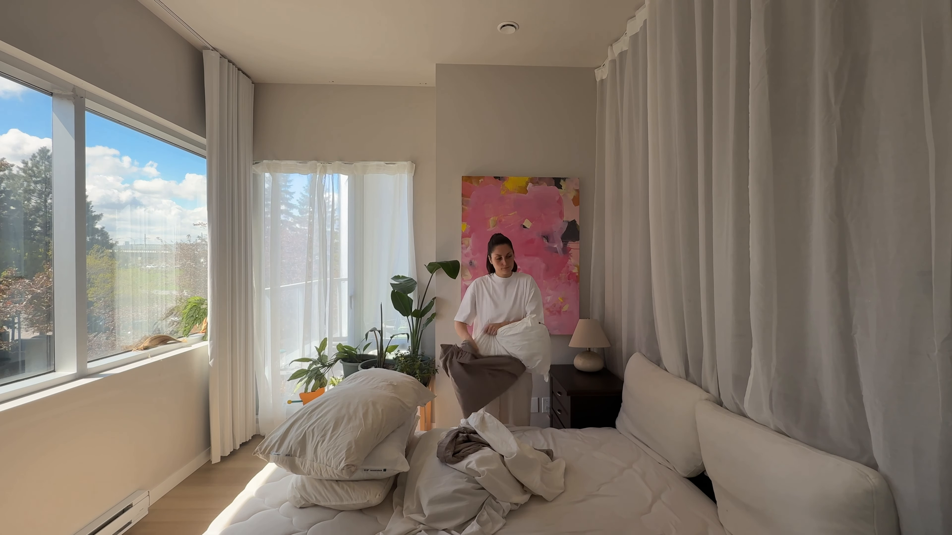 Residential cleaning professional dusting a living room near Stuyvesant Square, Manhattan NYC