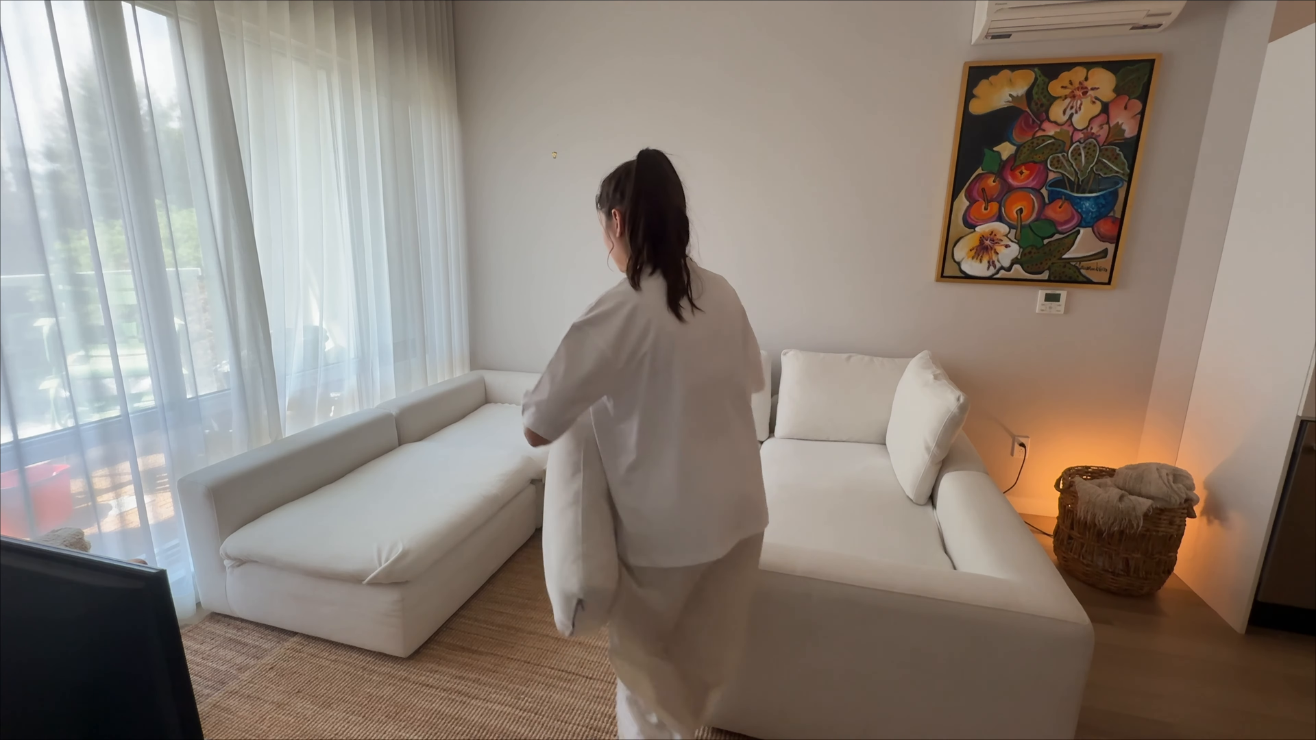 Cleaner arriving with supplies for a weekly apartment cleaning in Battery Park City, Manhattan