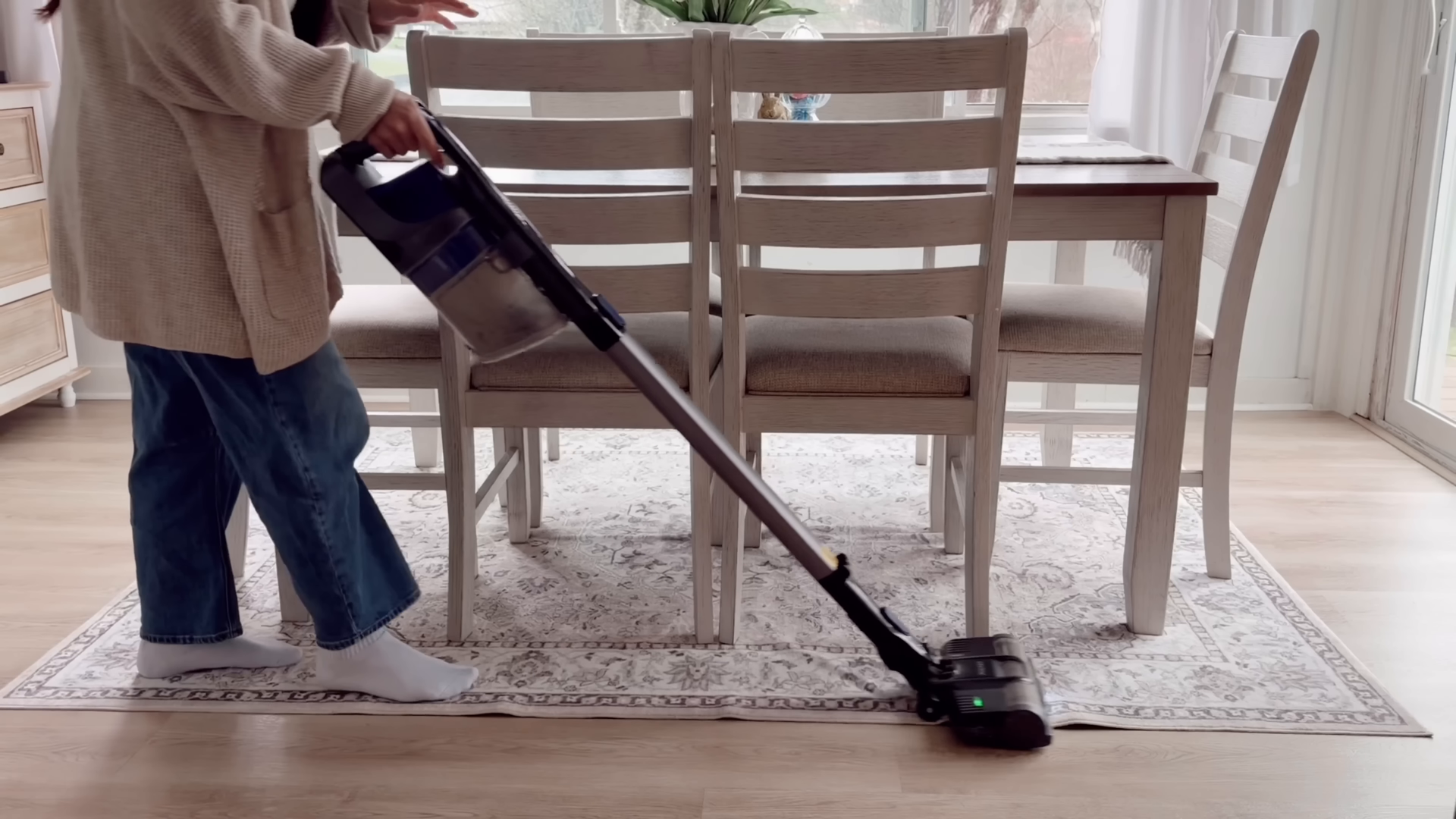 Background-checked house cleaner finishing an Upper East Side living room, Manhattan NYC