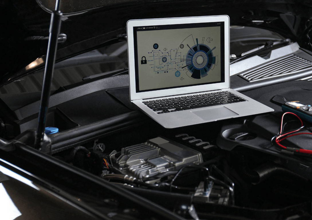 An image of a computer diagnosing a vehicles problem on-site. 