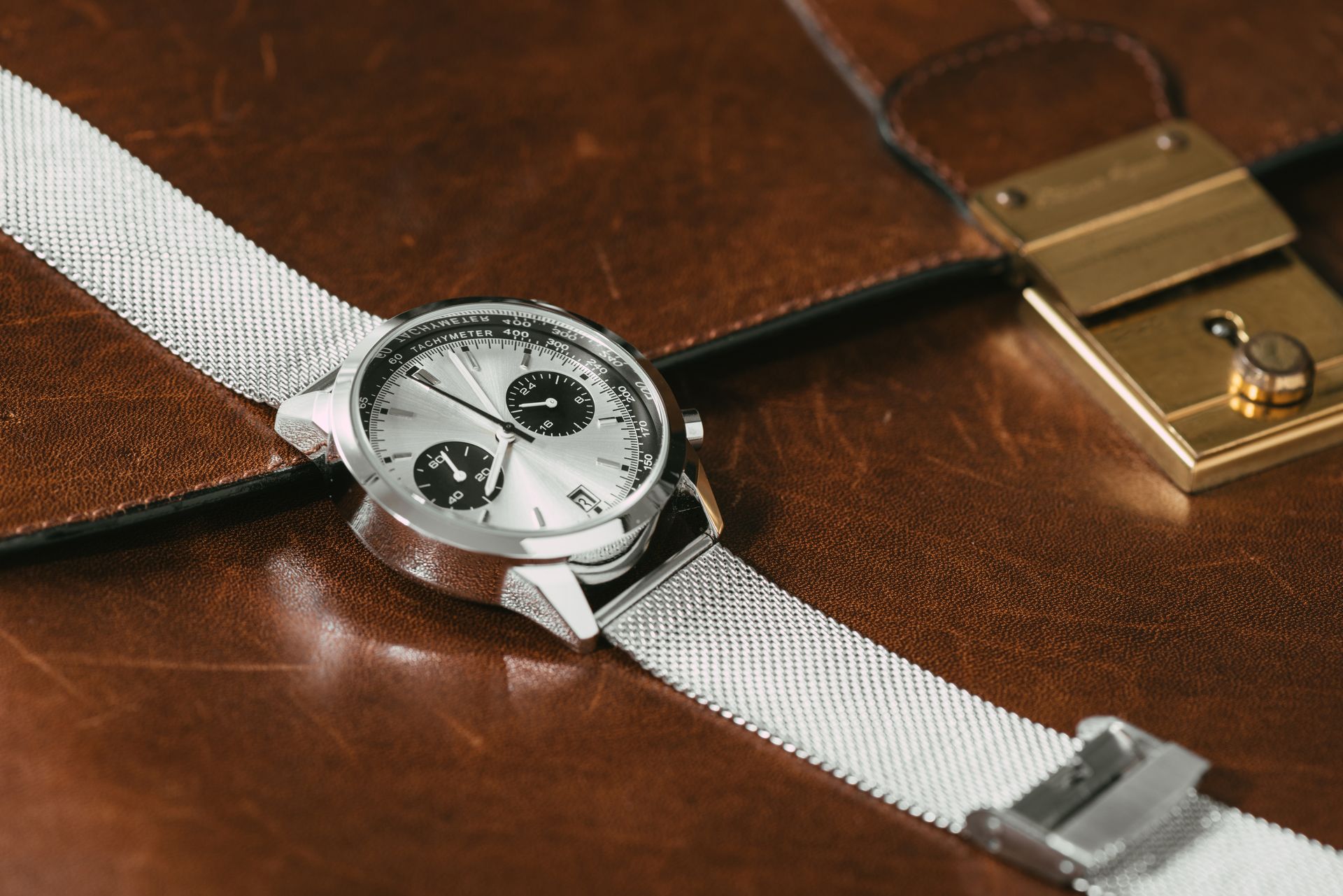 A Watch is Sitting on Top of a Brown Leather Briefcase — K. Smith & Son Jewellers In Caloundra, QLD