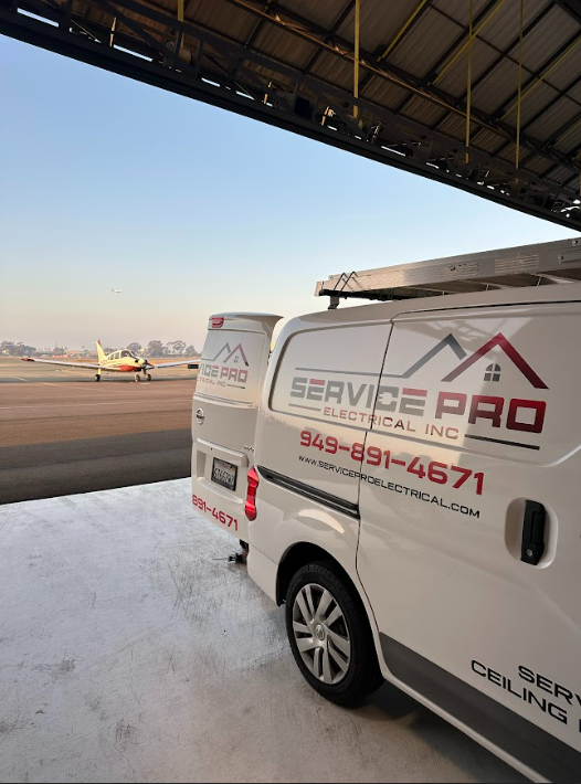 A white van with service pro written on the side