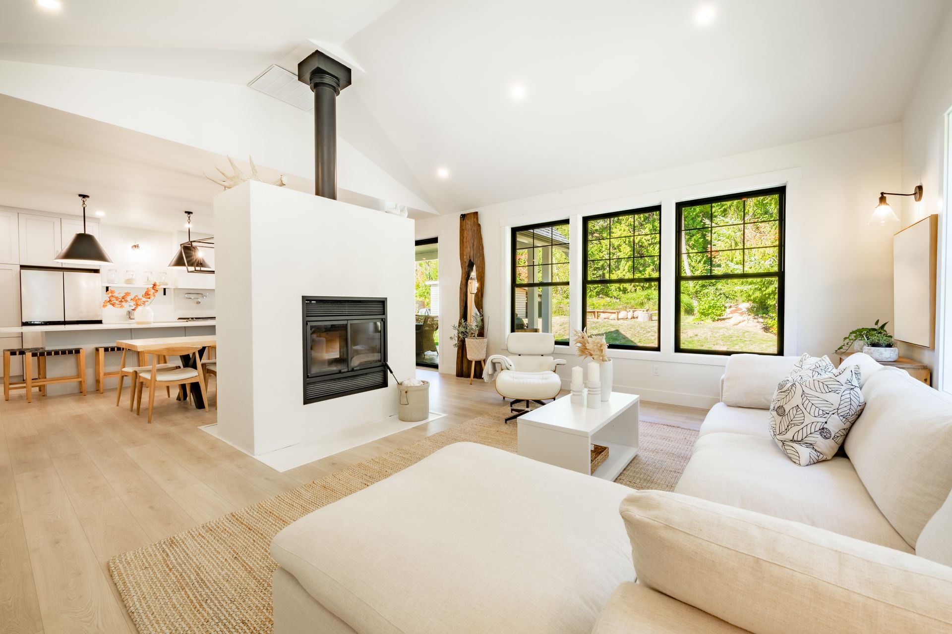 A living room filled with furniture and a fireplace.