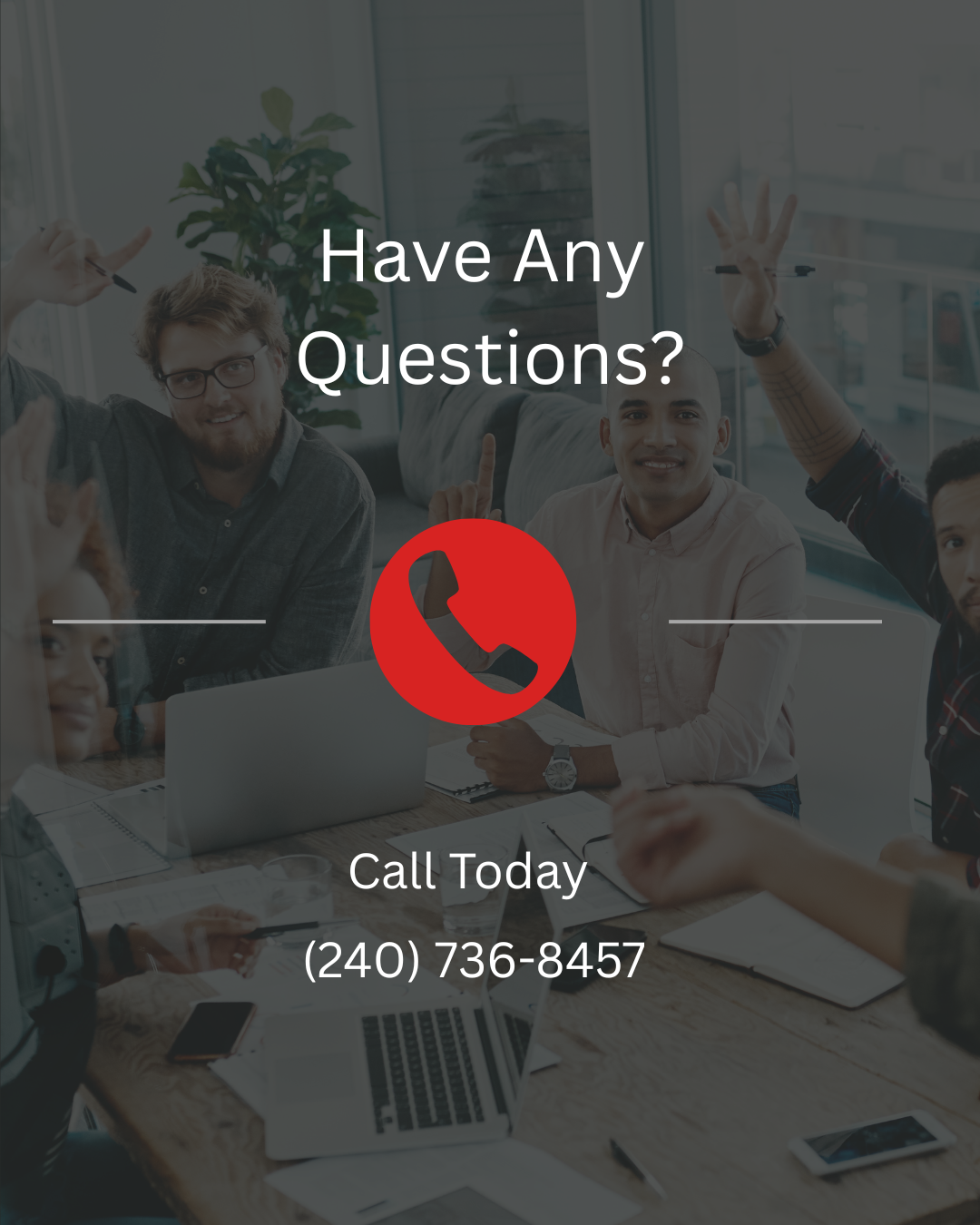 A group of people sitting around a table with a phone icon