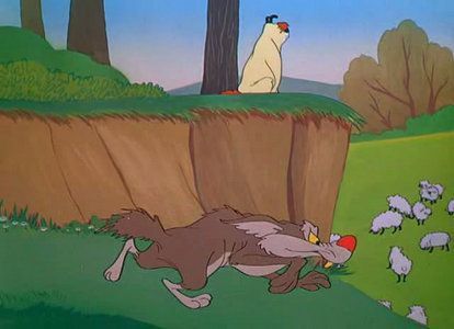 A still from a Looney Tunes cartoon with Sam the Shepherd and Ralph the coyote looking at a flock of sheep. 