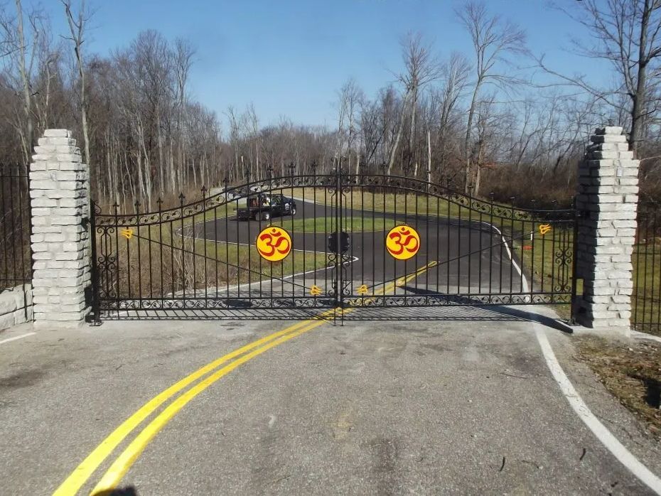 Black iron gate with yellow 