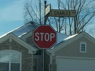 Stop sign at an intersection, with street sign 